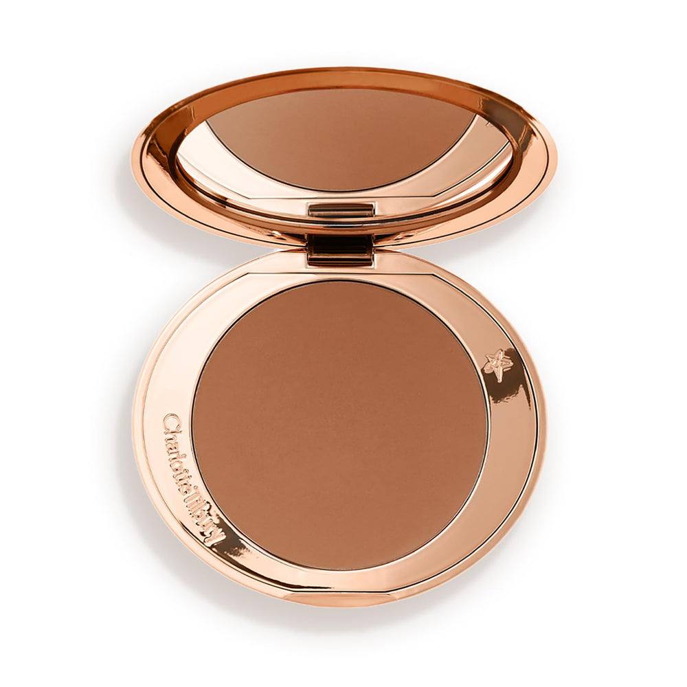 Charlotte Tilbury compact front view showing sleek case and bronzer for travel