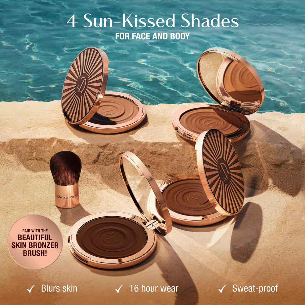 Charlotte Tilbury bronzing brush loaded with cream for seamless application