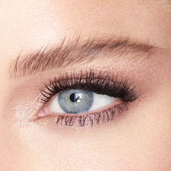 Charlotte Tilbury Champagne (Jean) lid swatch on skin showing luminous shine and brightening effect