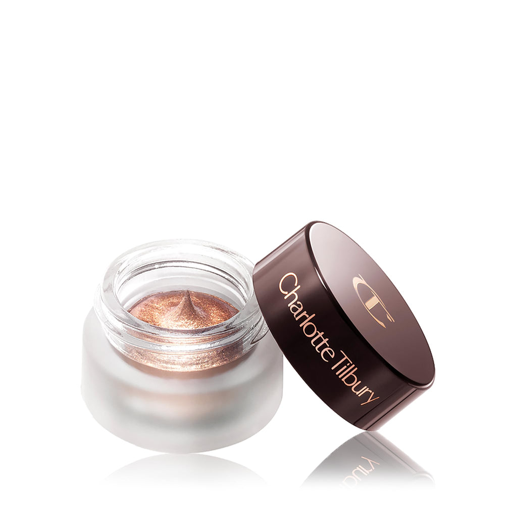 Charlotte Tilbury eye close-up wearing Oyster Pearl showing luminous finish benefit