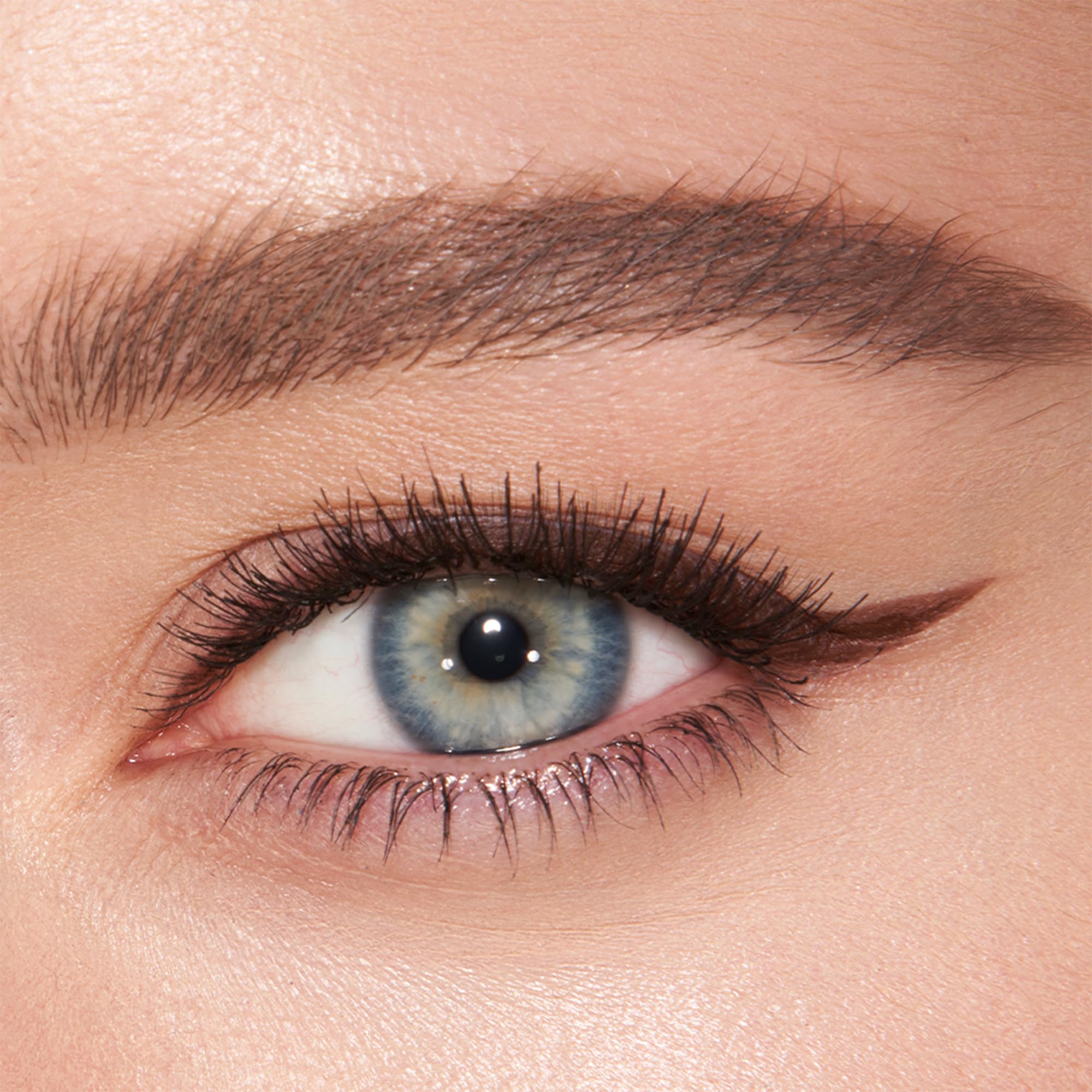 Charlotte Tilbury Super Brown swatch on skin displaying matte, rich pigment and true-to-shade payoff