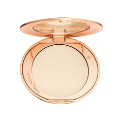 Charlotte Tilbury front compact closed showing sleek packaging and portable benefit