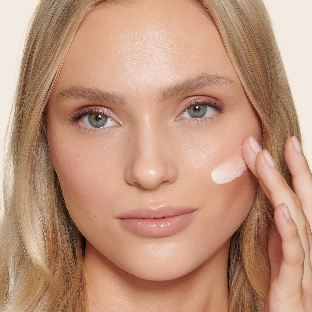 Charlotte Tilbury application on hand demonstrating buildable, even coverage