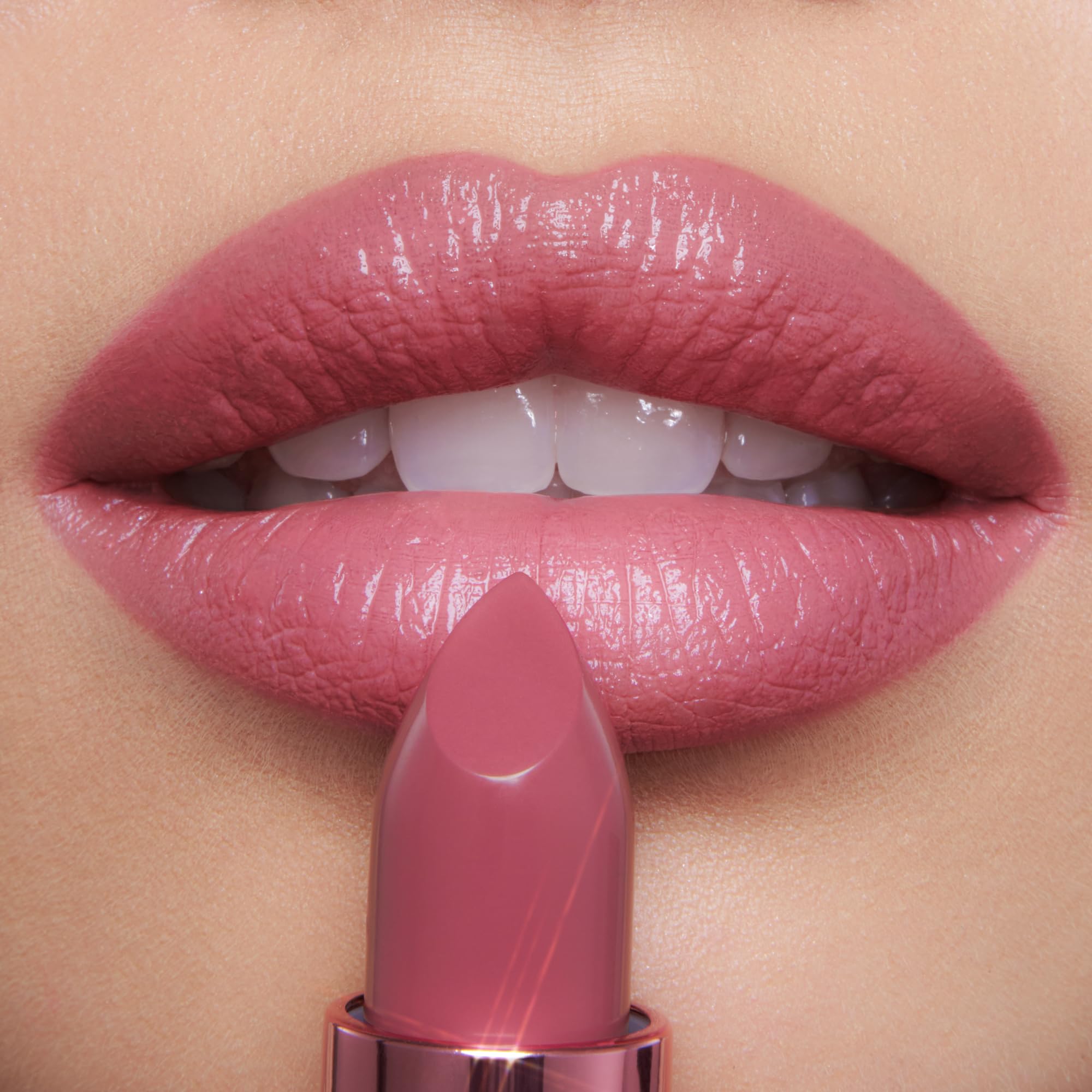 Charlotte Tilbury swatches on hand showing color payoff and blending ease