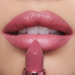 Charlotte Tilbury swatches on hand showing color payoff and blending ease