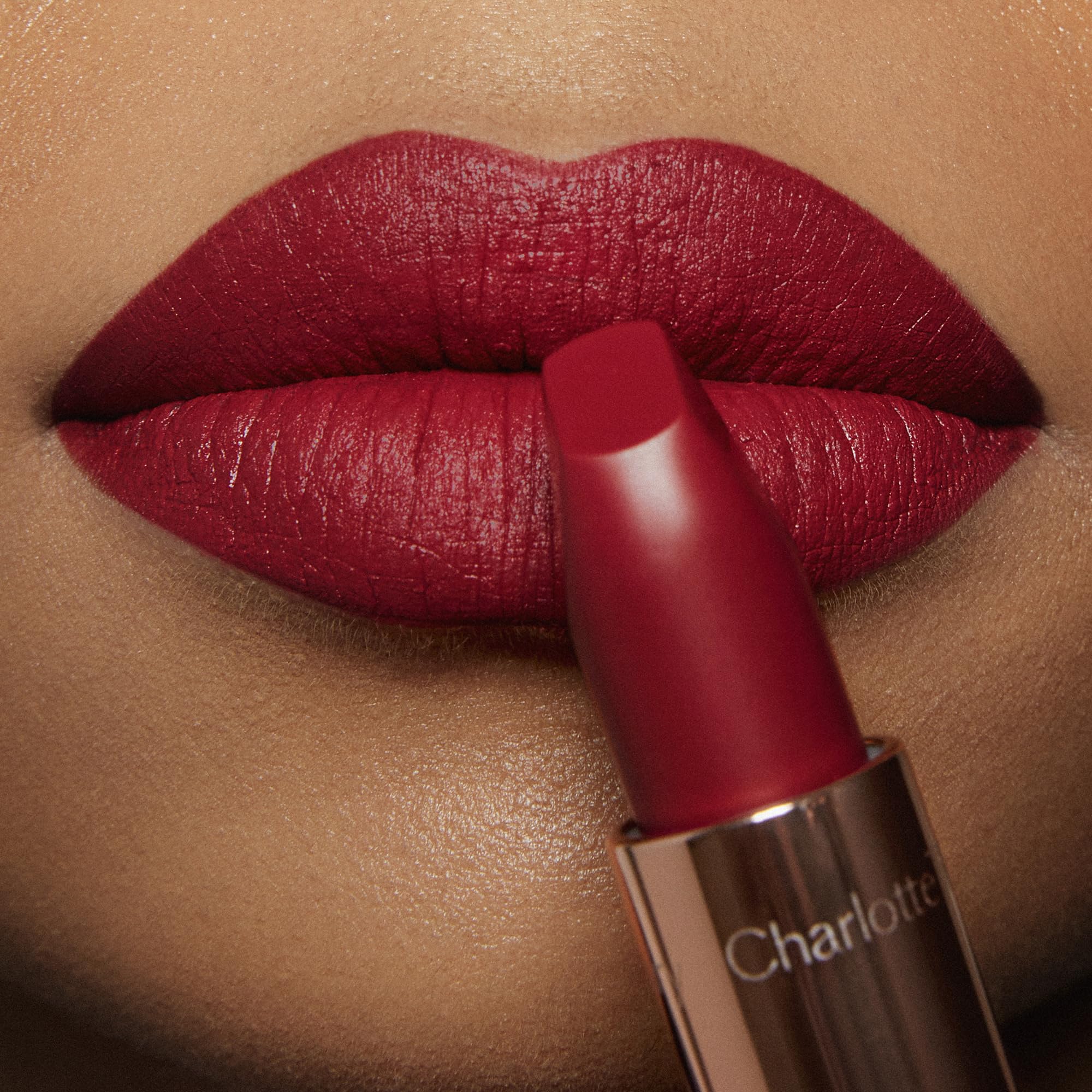 Charlotte Tilbury lipstick worn by model for an evening look providing classic glamorous finish