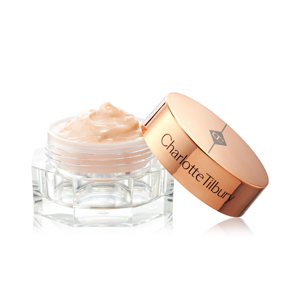Charlotte Tilbury 15ml size and scale beside a fingertip to show compact travel-friendly volume
