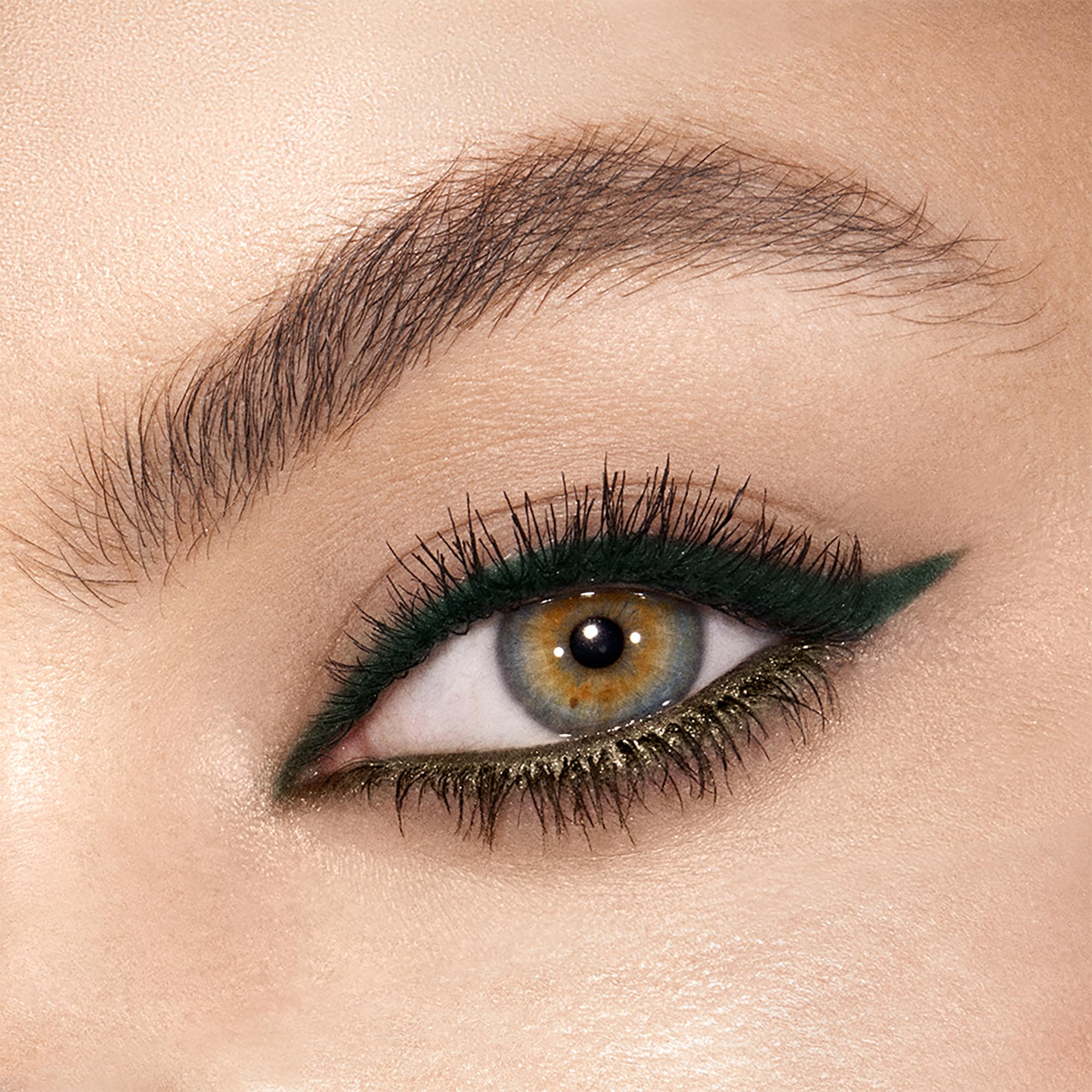 Charlotte Tilbury swatch texture showing creamy matte and shimmering metallic finish benefits