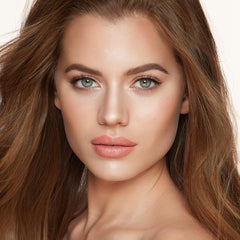 Charlotte Tilbury palette applied on cheek for sculpted, camera-ready definition