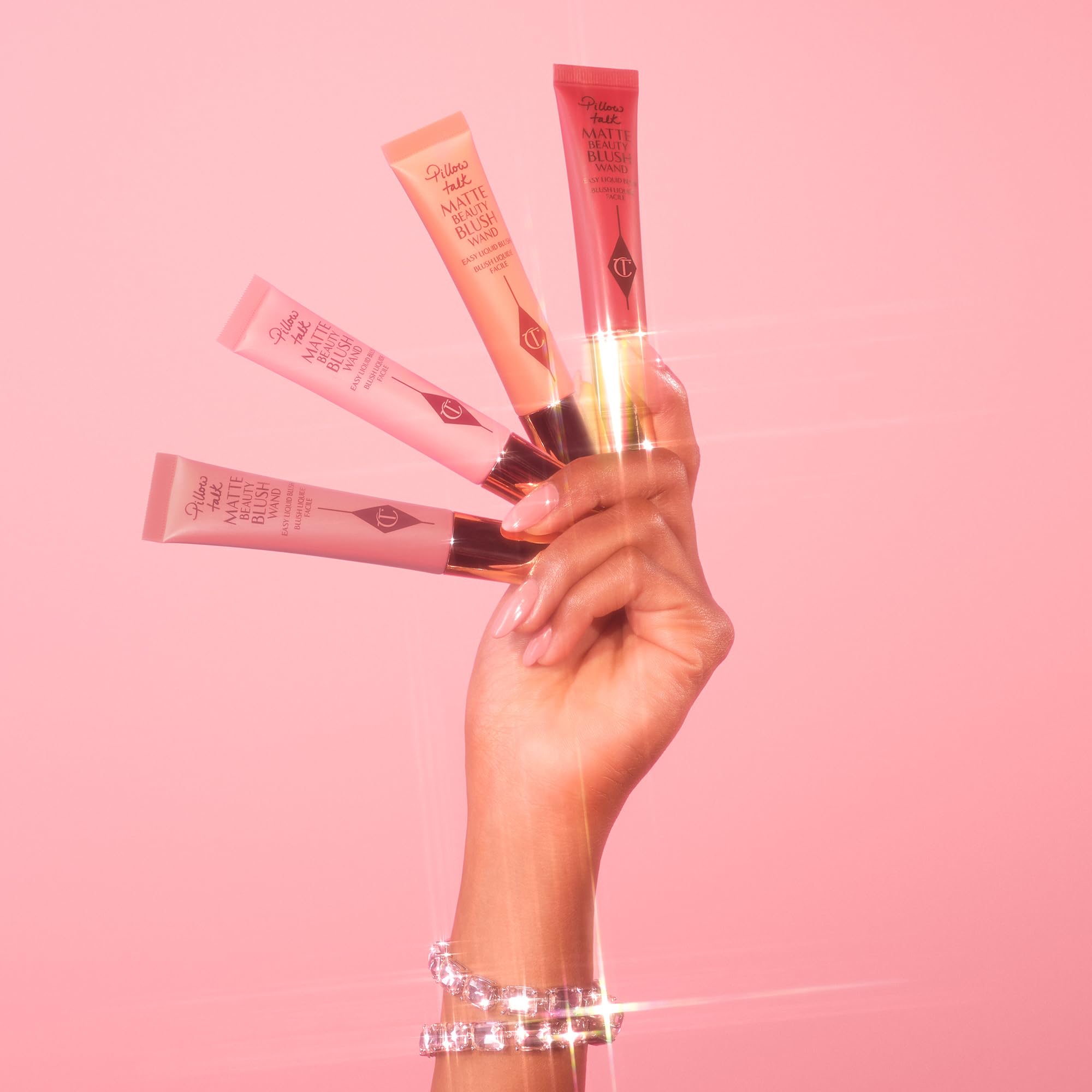 Charlotte Tilbury in a beauty bag lifestyle shot illustrating on-the-go touch-ups