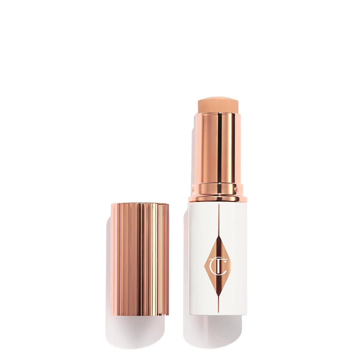 Charlotte Tilbury foundation stick front view showing sleek tube and shade for easy selection