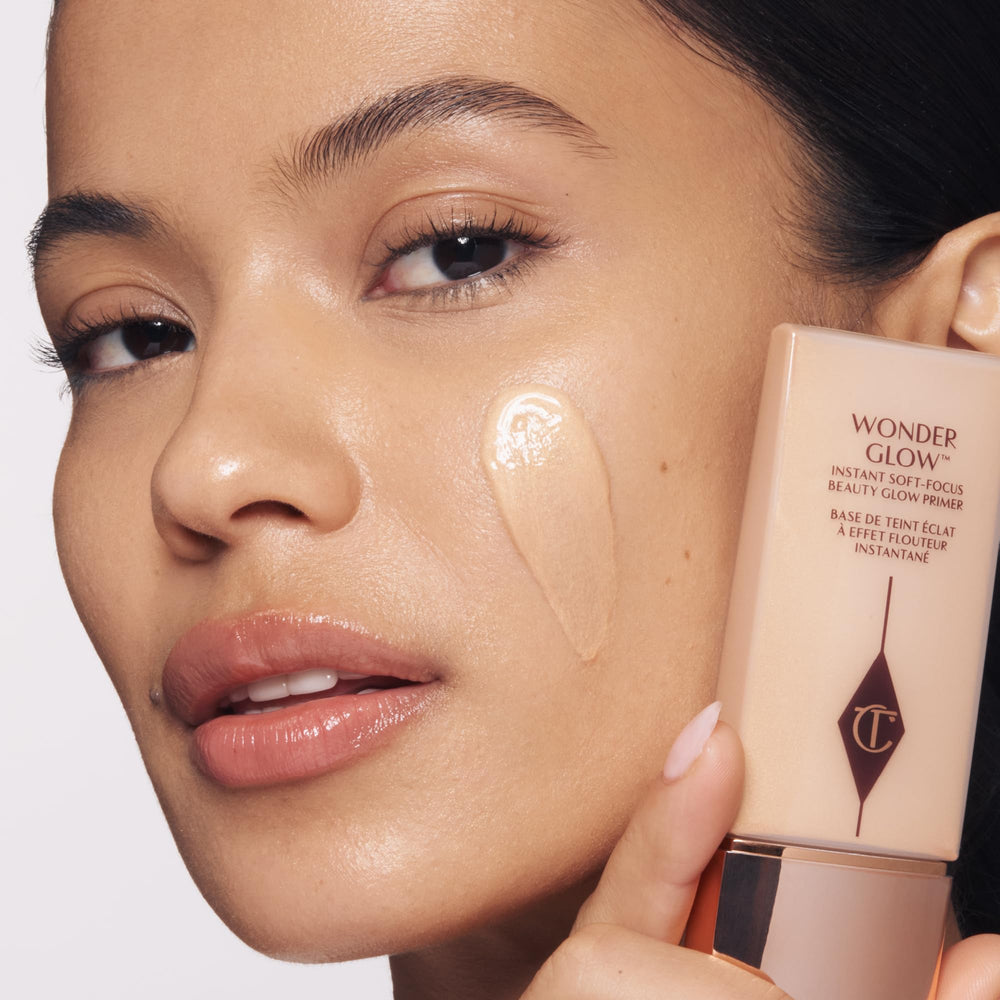 Charlotte Tilbury close-up swatch of Wonderglow cream showing pearlescent finish for soft-focus glow