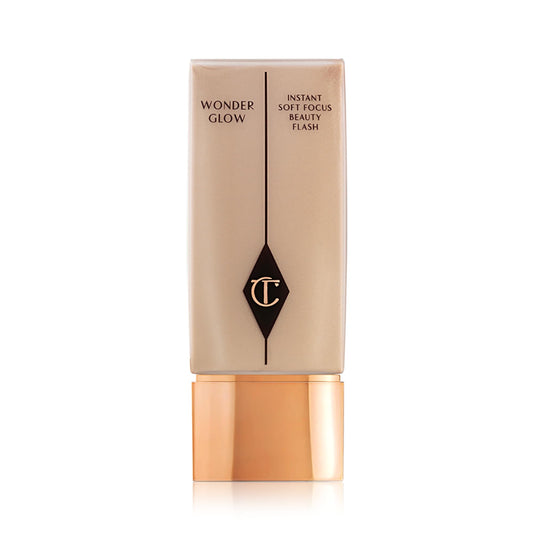Charlotte Tilbury Wonderglow front tube shows luminous packaging and elegant design benefits daily use