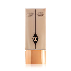 Charlotte Tilbury Wonderglow front tube shows luminous packaging and elegant design benefits daily use