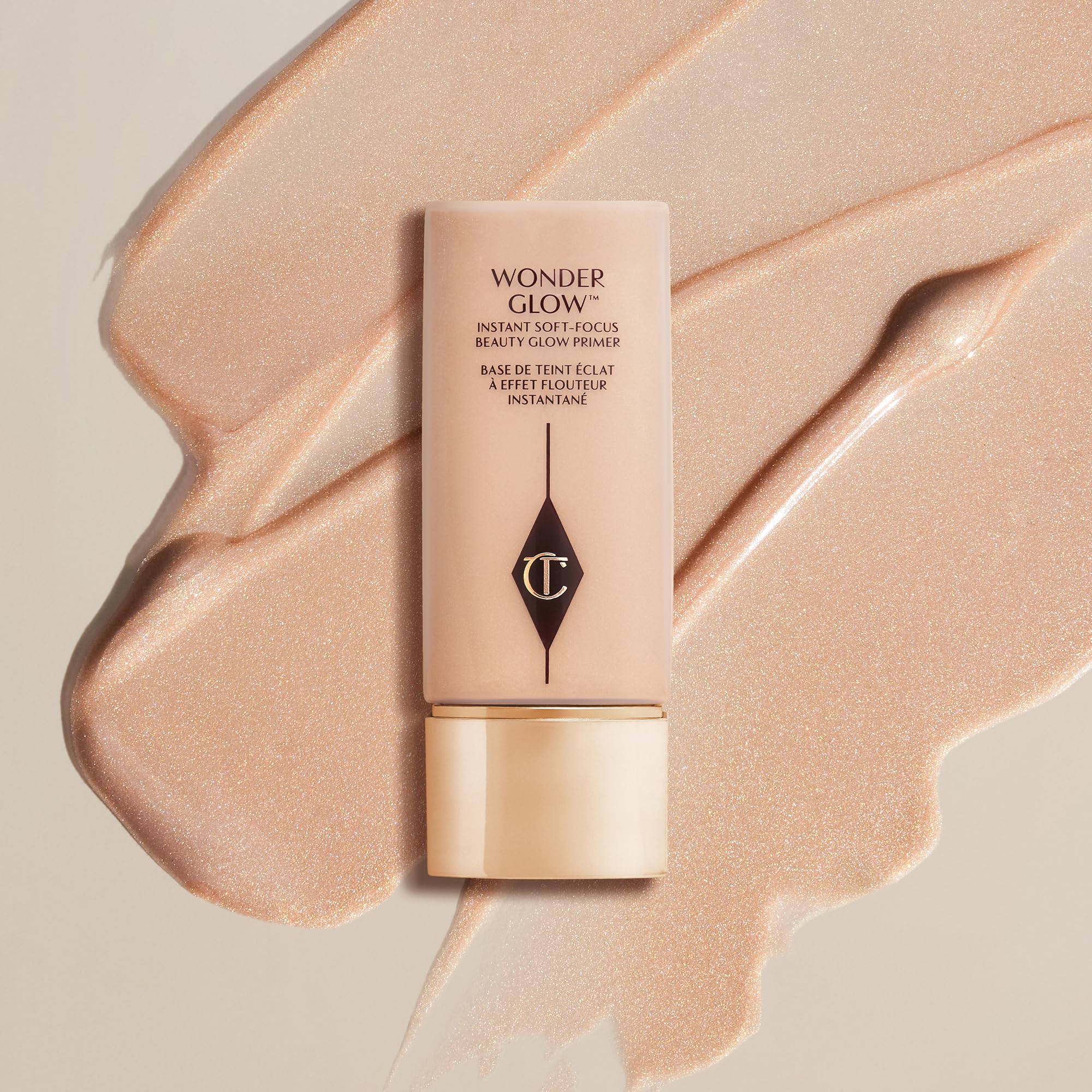 Charlotte Tilbury pump action releasing primer texture highlighting smooth application and hydration
