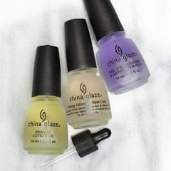 China Glaze base coat staged with polishes in a salon setting for long-lasting manicures