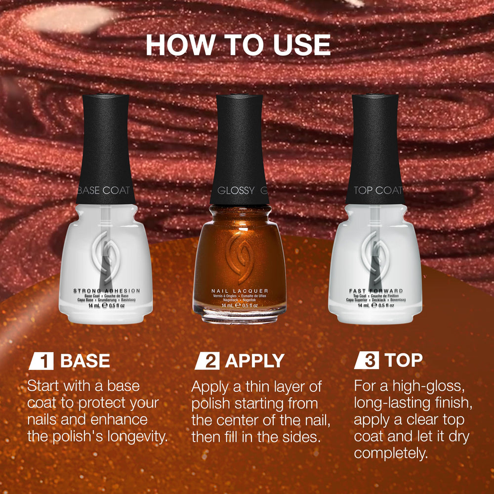 China Glaze bottle next to hand to show Golden Acorn size and scale