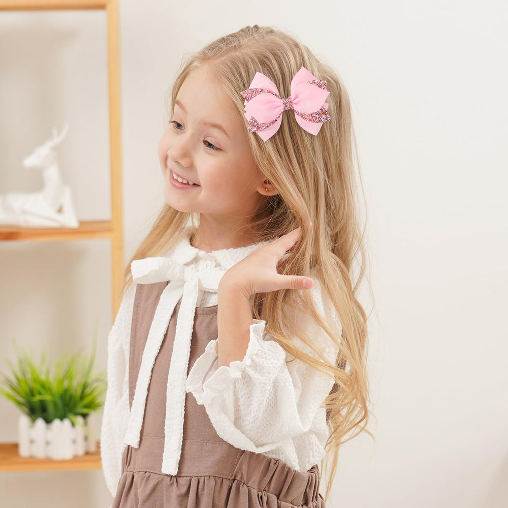 choicbaby bow clipped into toddler ponytail for pretty styling