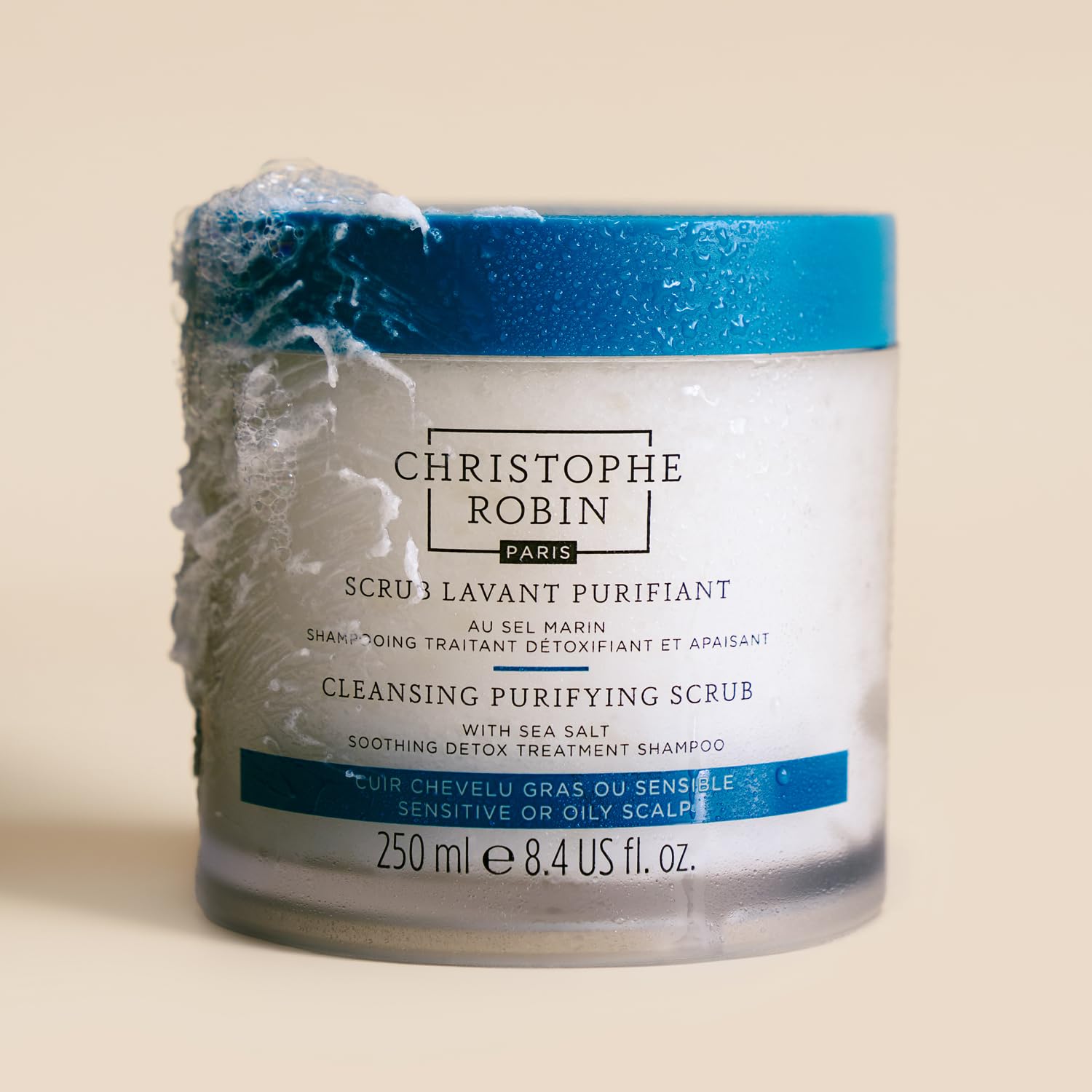 Christophe Robin scrub in hand ready to apply for targeted detox