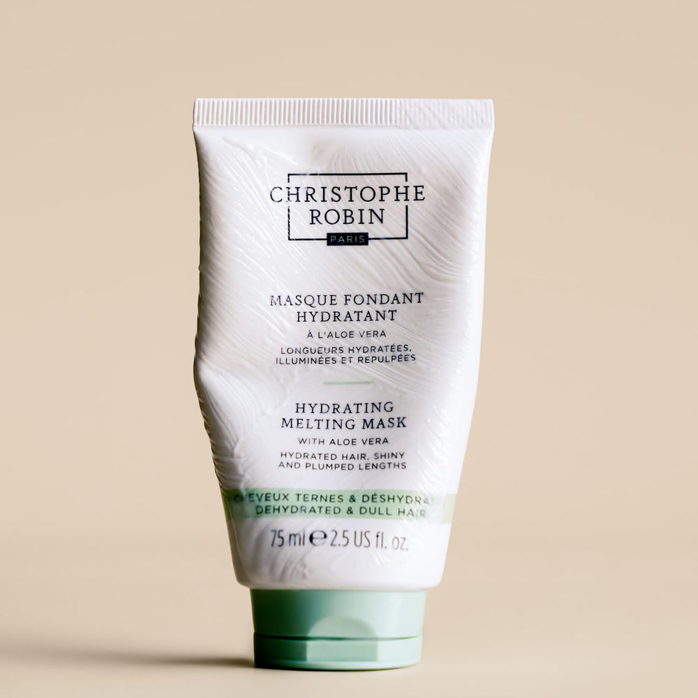 Christophe Robin jar on bathroom shelf styled for travel-ready hair care