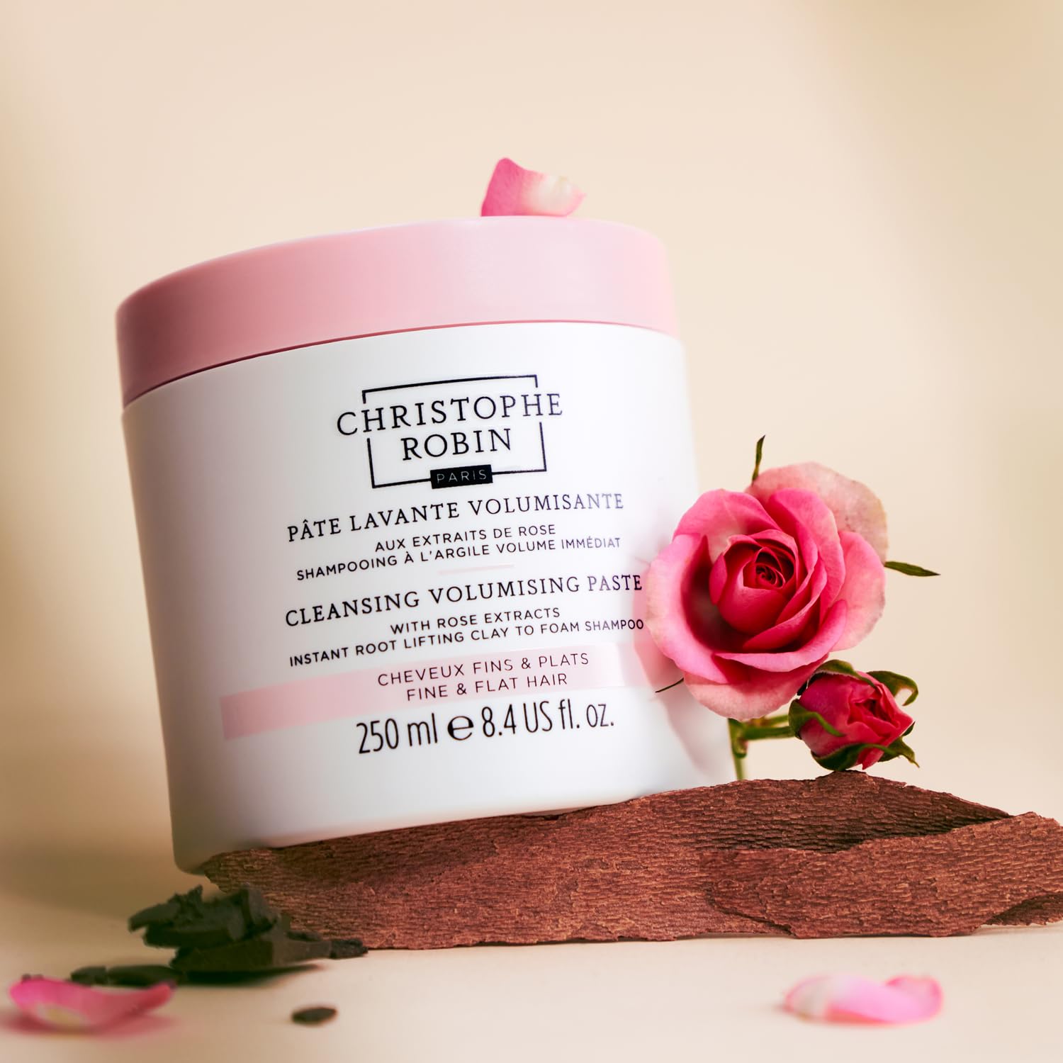 Christophe Robin product next to ruler showing 8.4 fl oz scale and value