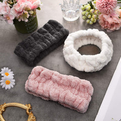 Chuangdi headband beside hand for scale to show comfortable width