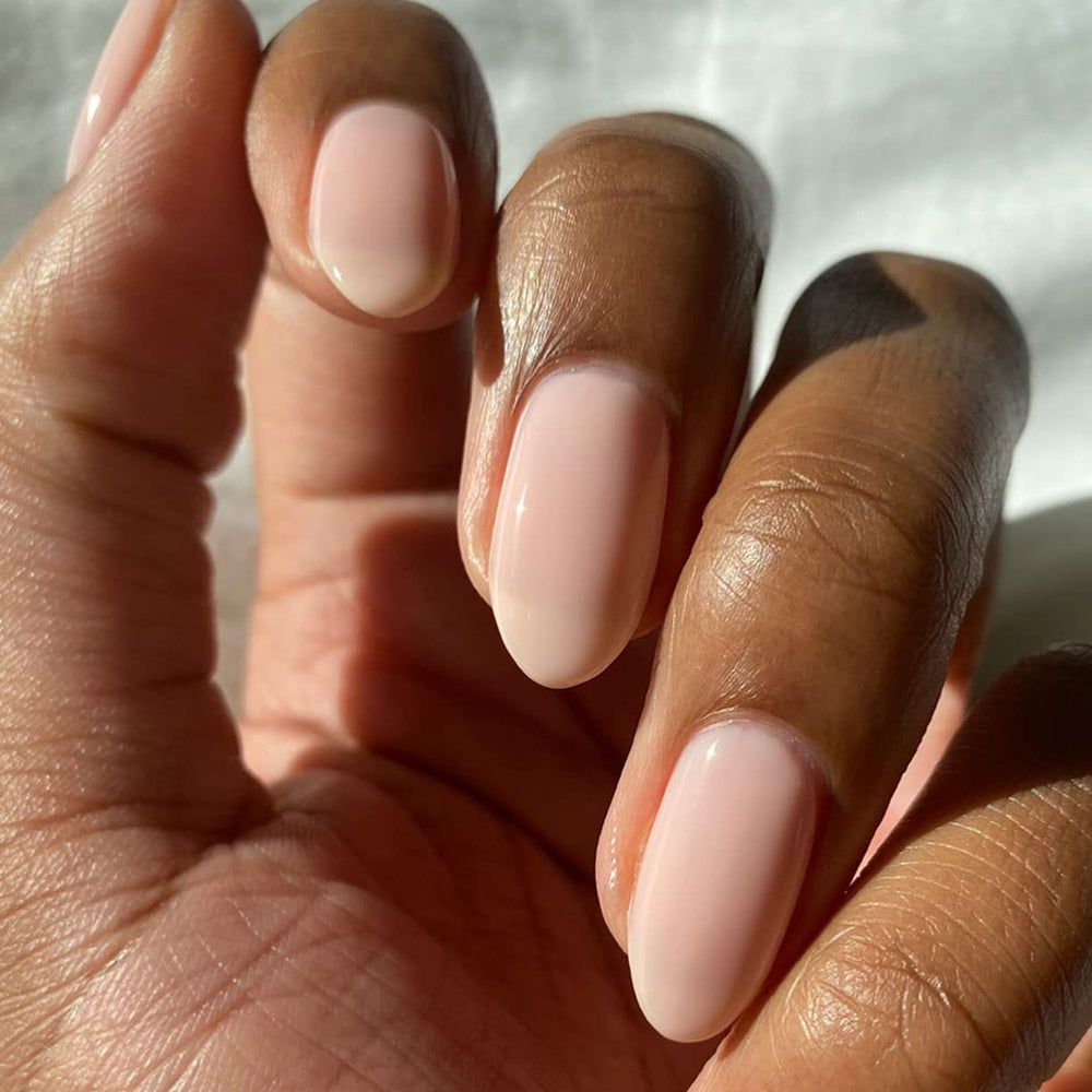 Nails with glitter art over chiffon base showing layering ability benefit: versatile canvas