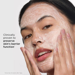 Clarins cleanser applied to cheeks showing gentle massage benefit