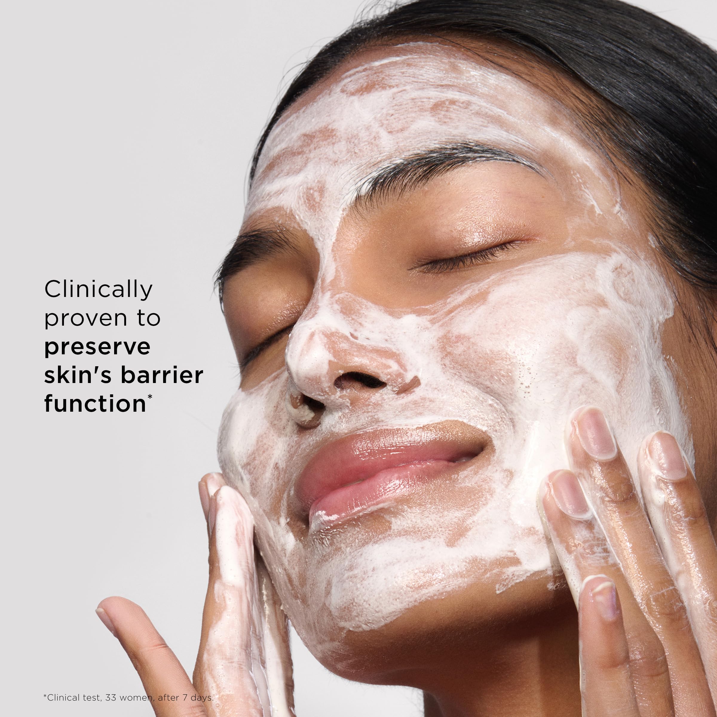 Clarins cleanser in hand showing 4.2 oz size for travel convenience