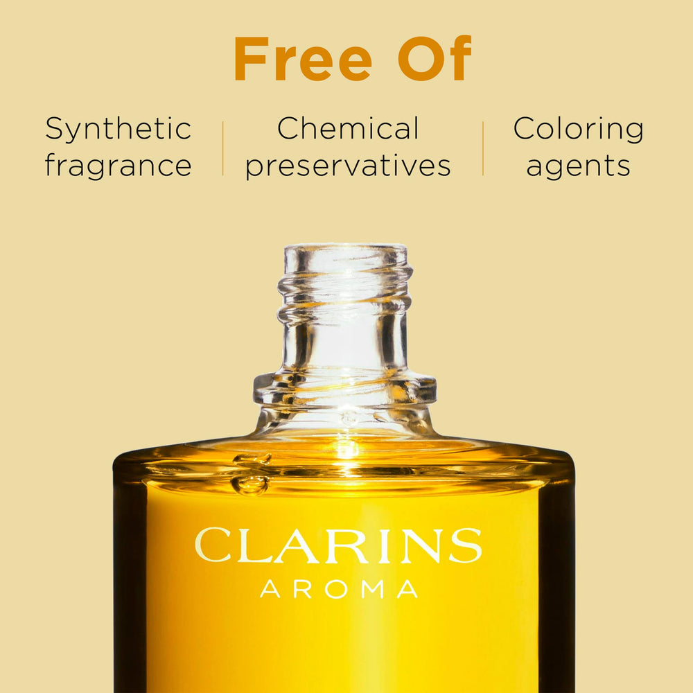 Clarins bottle in hand demonstrating size and easy application benefit