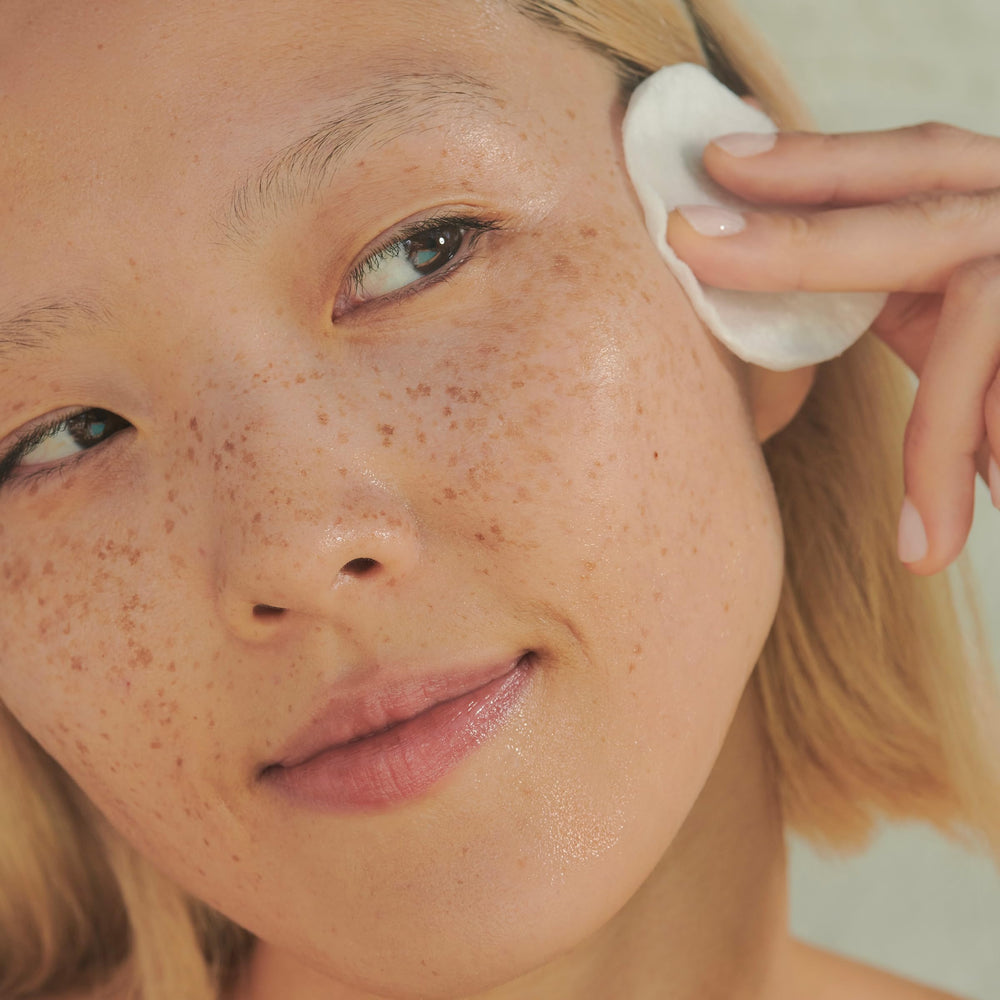 Clarins product in hand demonstrating easy application and absorbency
