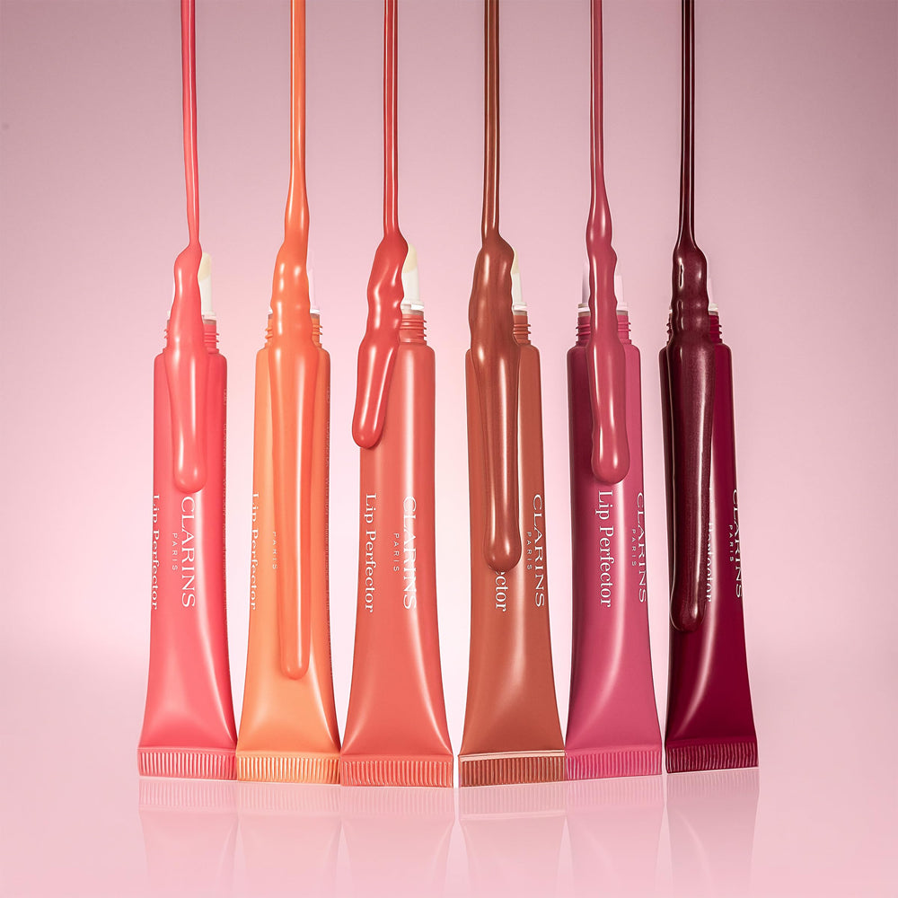 CLARINS placed inside a purse in lifestyle shot showing everyday portability and convenience