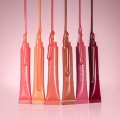 CLARINS placed inside a purse in lifestyle shot showing everyday portability and convenience