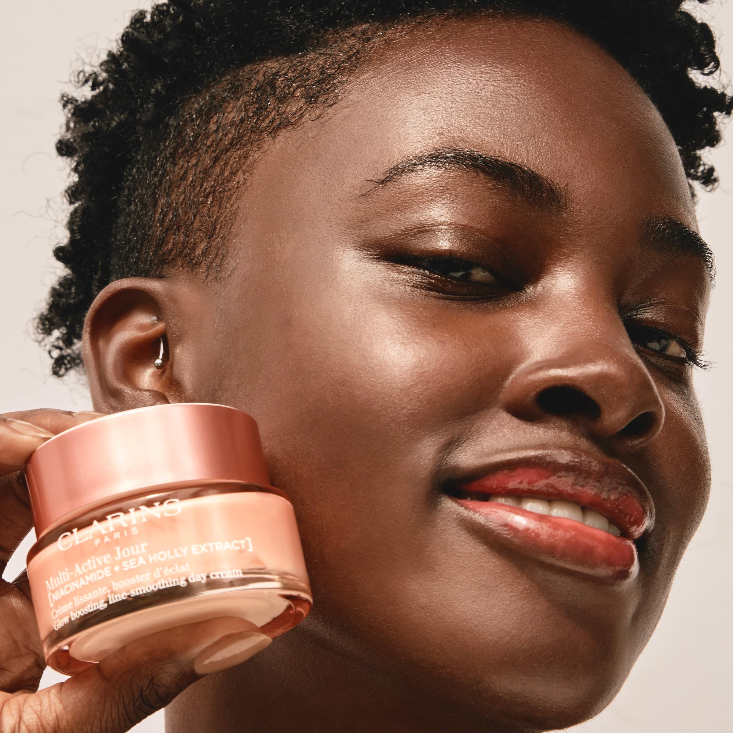 Clarins moisturizer on bathroom counter in morning routine offering daily-use benefit
