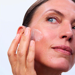 Clarins applied on woman's face during morning routine for lifted appearance