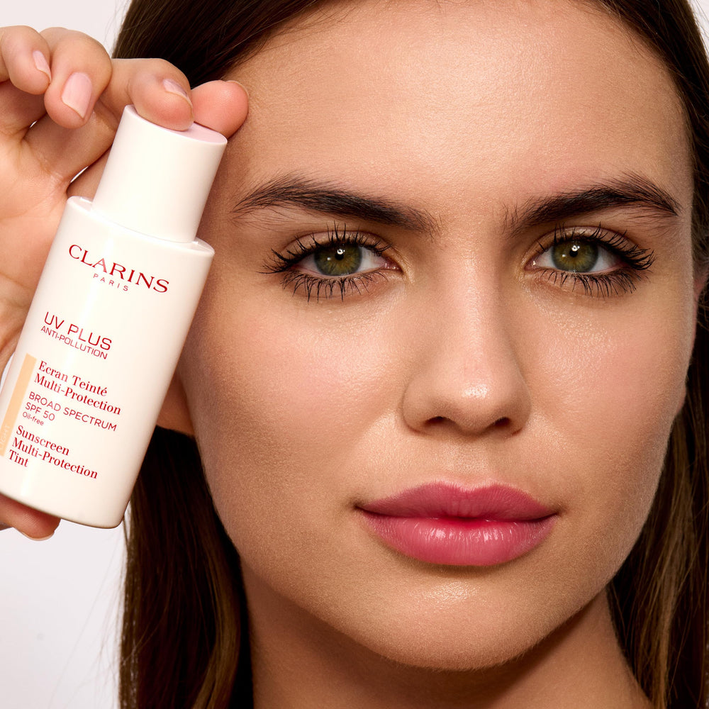 Clarins sunscreen in outdoor lifestyle scene protecting skin from pollutants