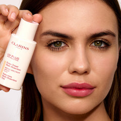 Clarins sunscreen in outdoor lifestyle scene protecting skin from pollutants