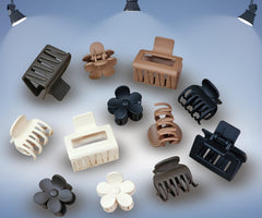 Clawposh neutral clips arranged with outfit pieces for coordinated styling