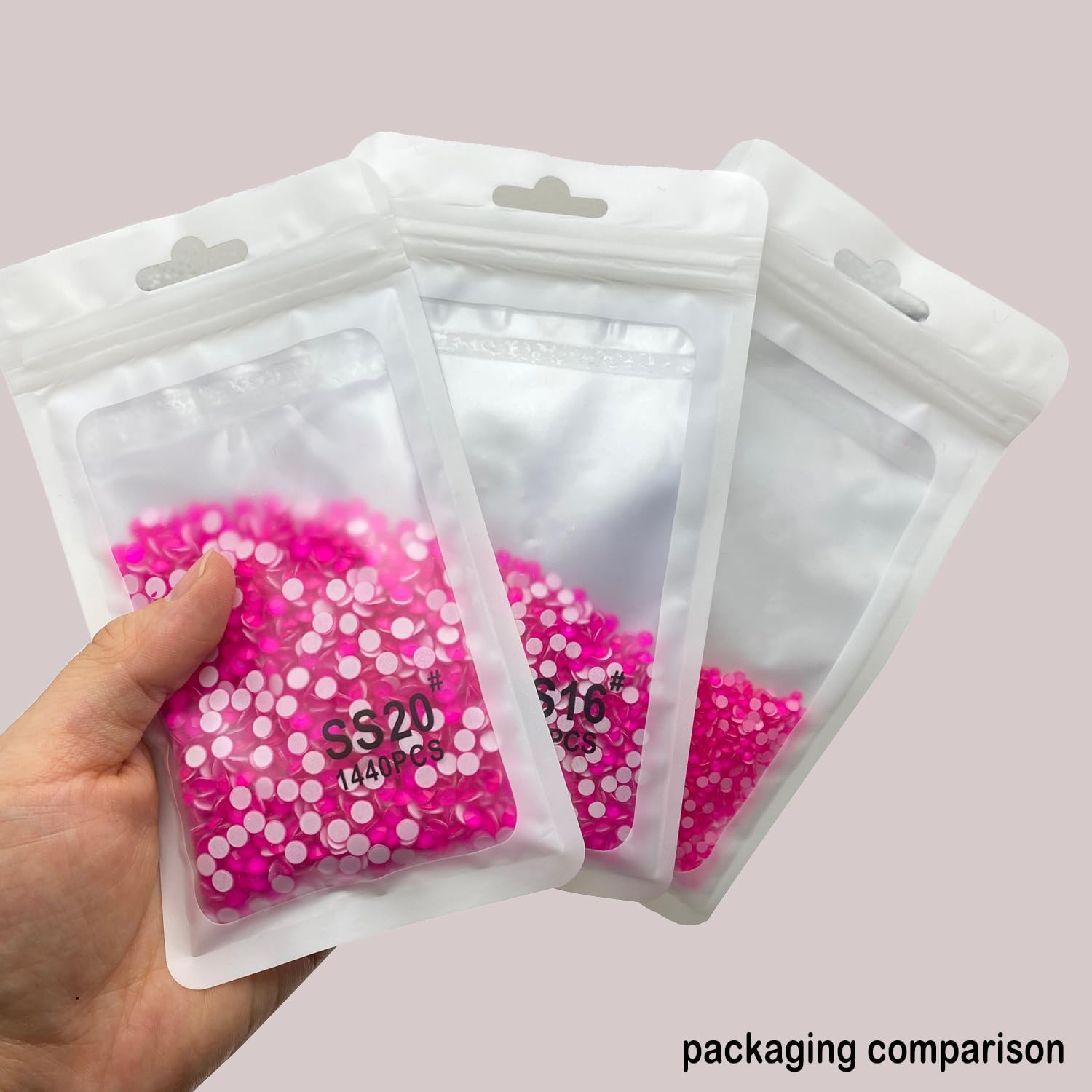 CLEKSPOYE rhinestones applied to nails showing precise placement and shine