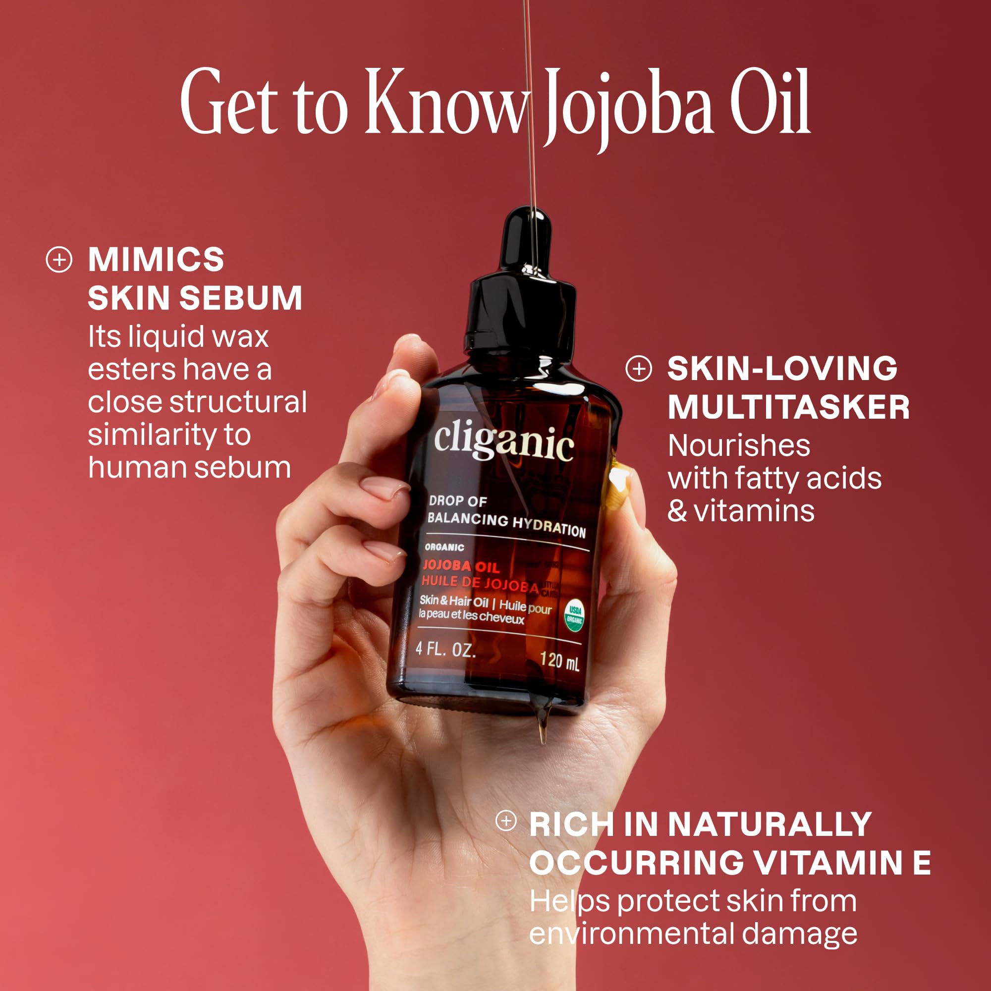 Cliganic jojoba oil applied to hands for soft, hydrated skin
