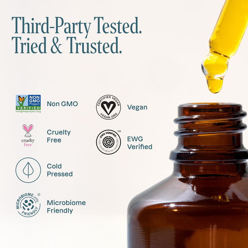 Cliganic jojoba oil applied to hair ends to reduce frizz and add shine