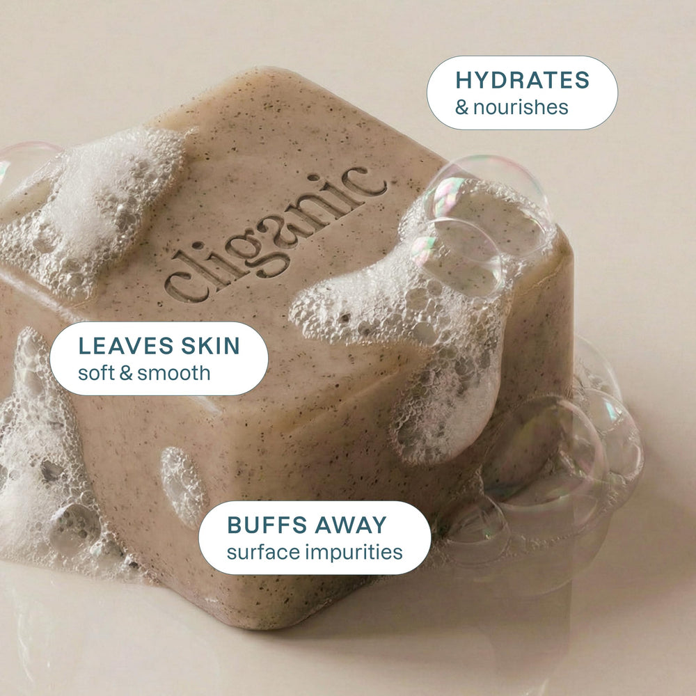Cliganic close-up of apricot seed particles in soap showing gentle scrub benefit: visible exfoliant texture