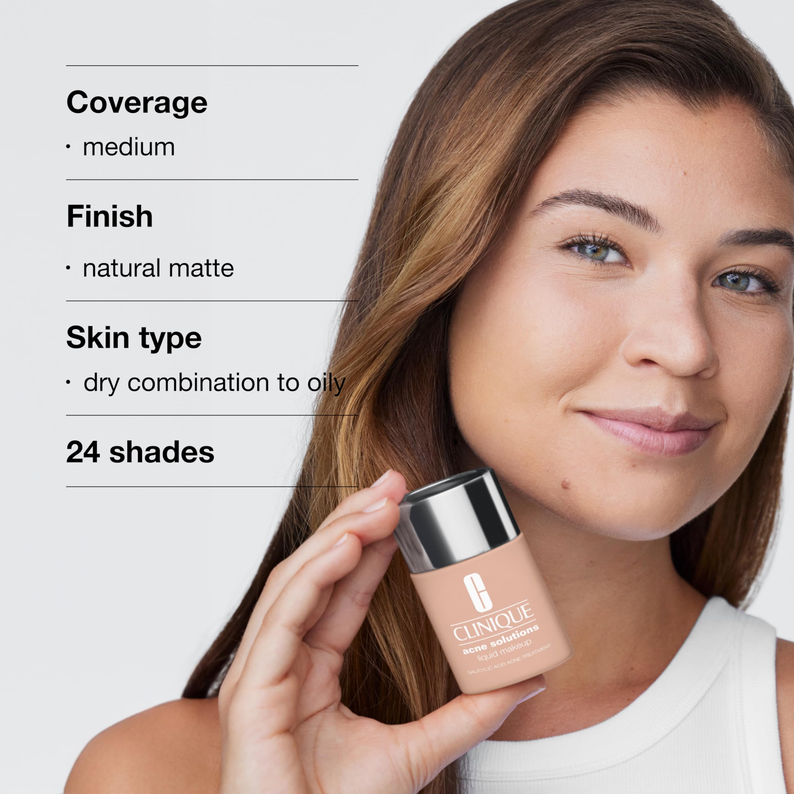 Clinique applying foundation on face to cover blemishes and reduce shine