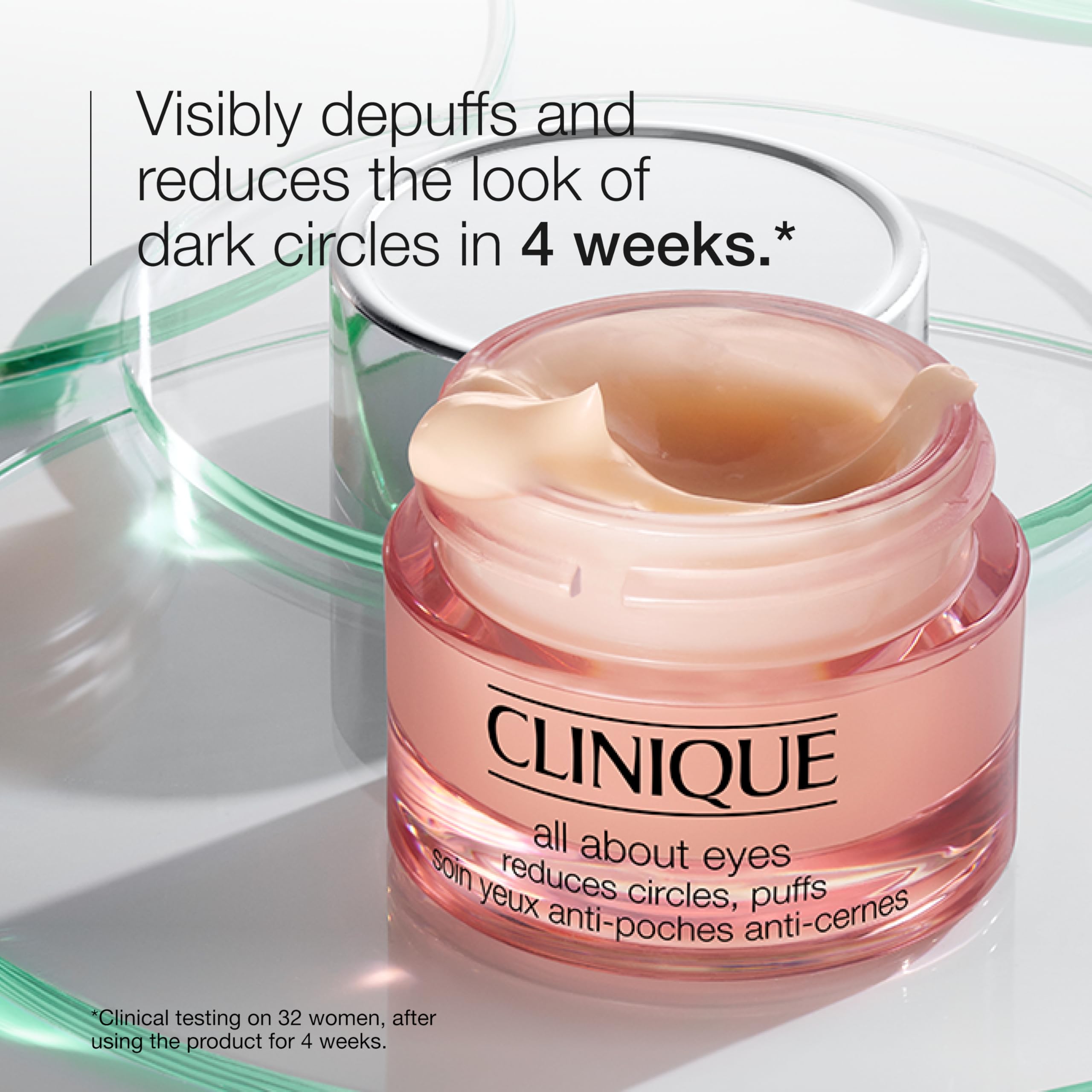 Clinique product on fingertip ready for gentle tapping to reduce puffiness