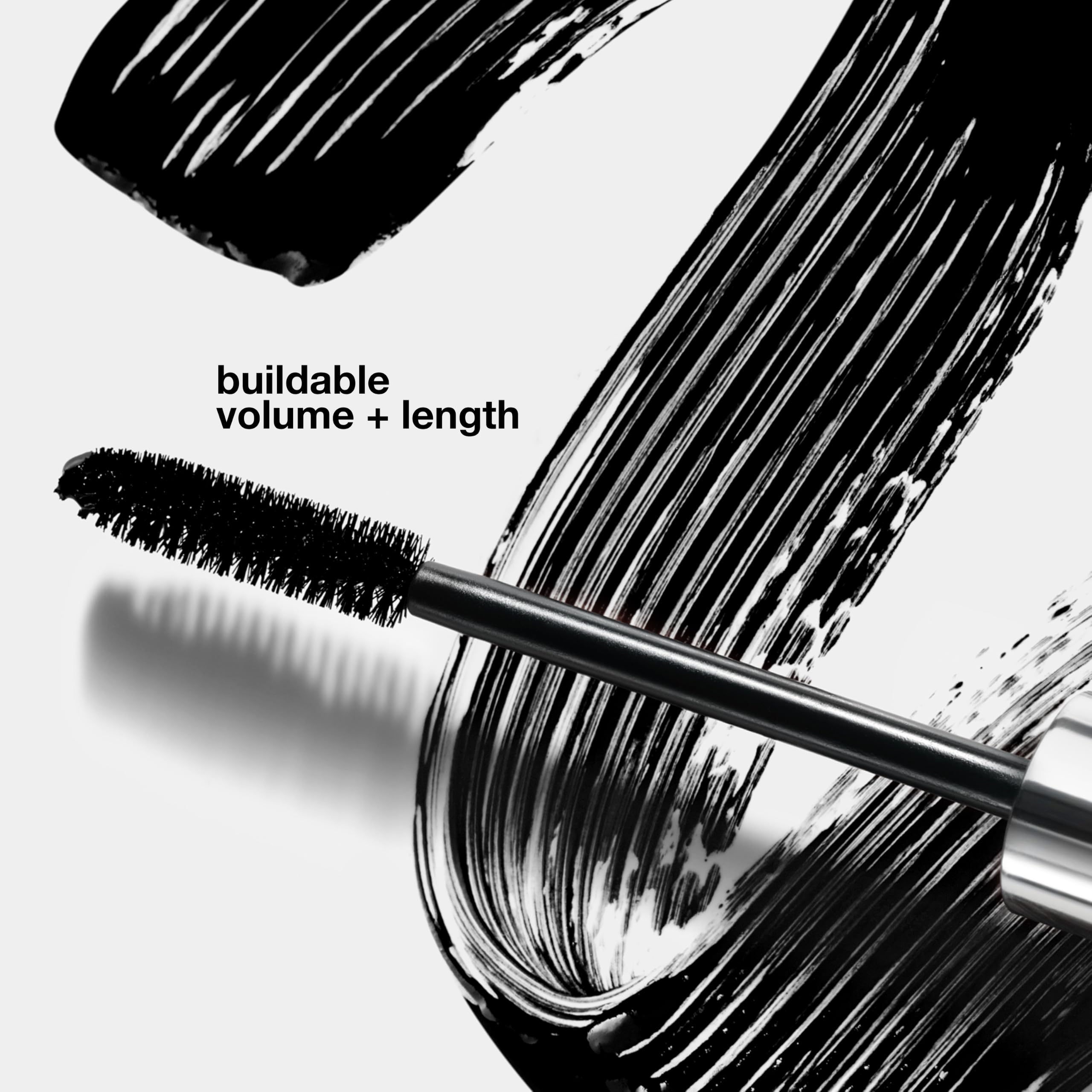 Clinique mini mascara held in hand to show travel-ready scale