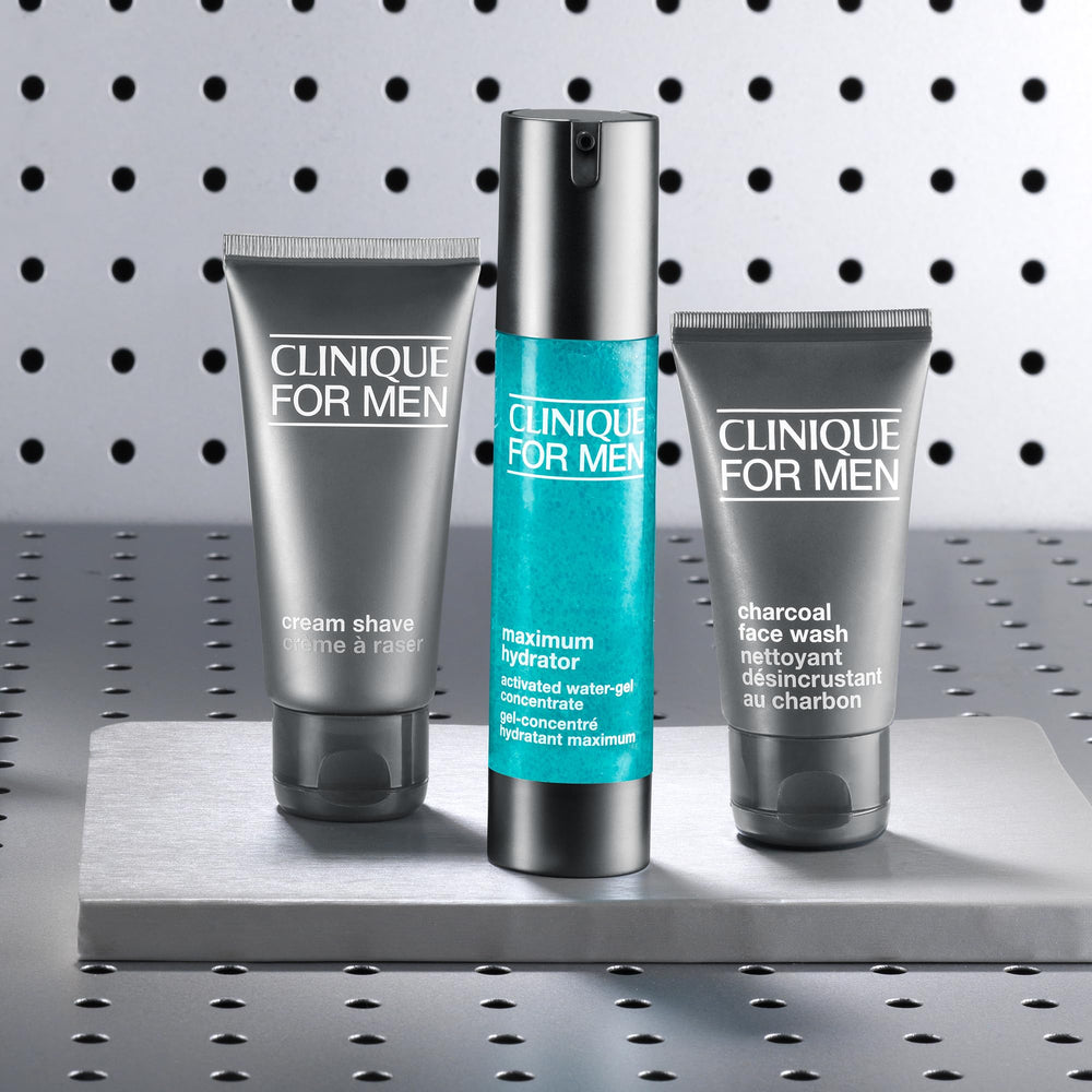 Clinique jar beside ruler showing 1.6 fl oz size for travel-friendly hydration