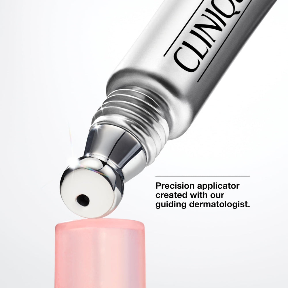 Clinique metal tip touching skin — cooling massage to help minimize puffiness
