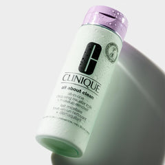 Clinique micellar milk being applied to cotton pad during nightly removal routine
