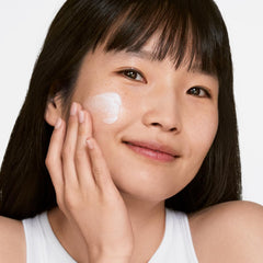 Clinique product dispensed into hand demonstrating smooth absorbency benefit