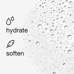 Clinique Moisture Surge spritzed over makeup demonstrating non-disruptive refresh benefit